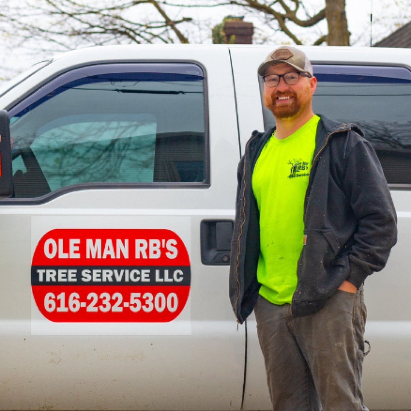 Owner Chris Holmes beside his branded Ole Man RB's truck in Belding, MI